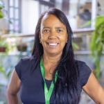 Patricia, fundadora e CEO do Pet Hotel Pampulha, sorrindo